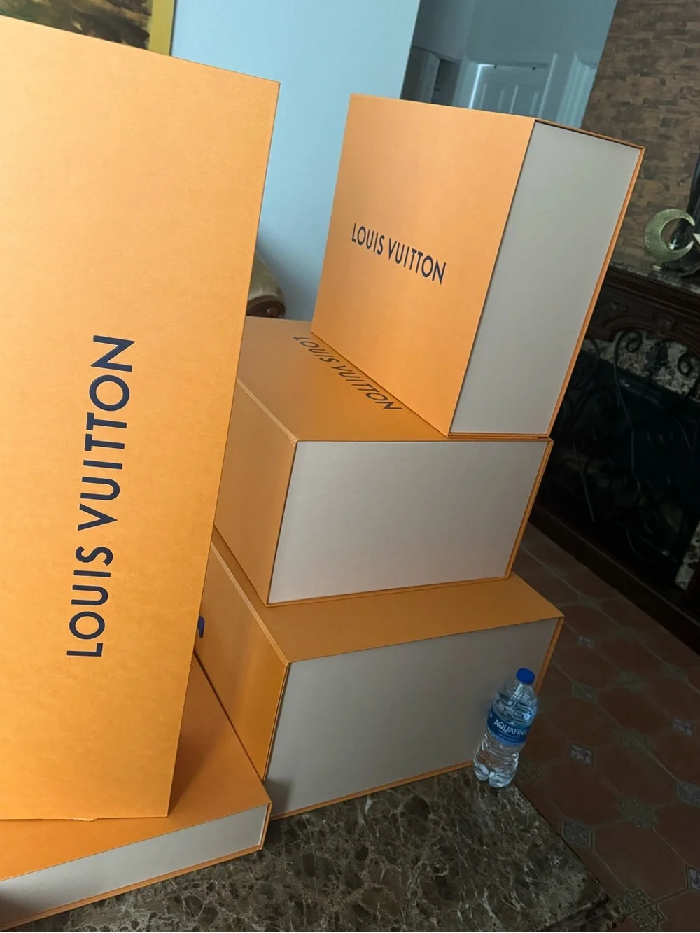 Louis Vuitton tan boxes with royal blue ribbons